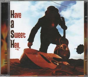 Hash - 'Have a sweet hell' Portada con una persona encontrando una guitarra en la arena.